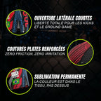 Gros plans techniques du short de combat Turbo rose Octogoat, mettant en avant la fente d'aisance latérale pour les kicks, les coutures plates anti-irritation et le motif nid d'abeille sublimé avec drapeau.